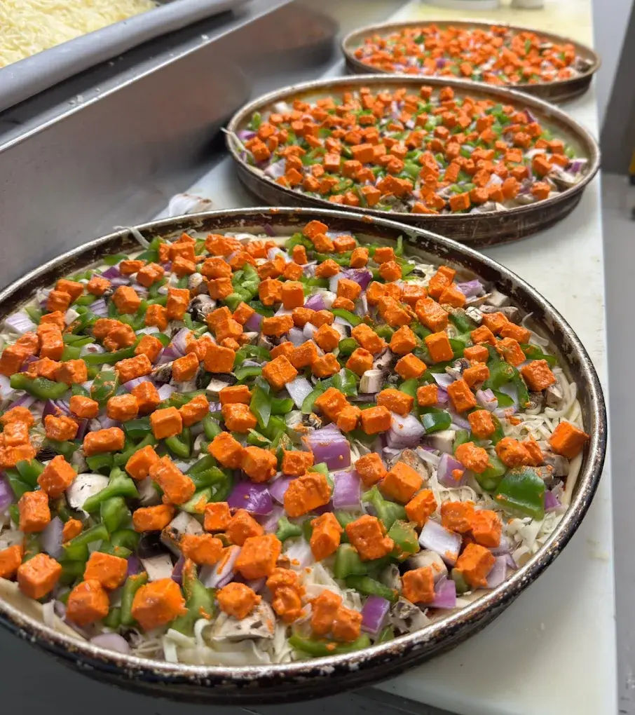 Supreme Pizza's signature Italian-Indian fusion pizzas - Authentic Tandoori Chicken, Paneer Tikka & Butter Chicken pizzas in Edmonton